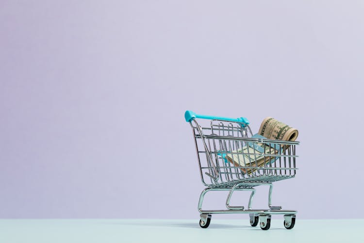 A Shopify Virtual Assistant managing a product catalog and customer service inbox on a laptop